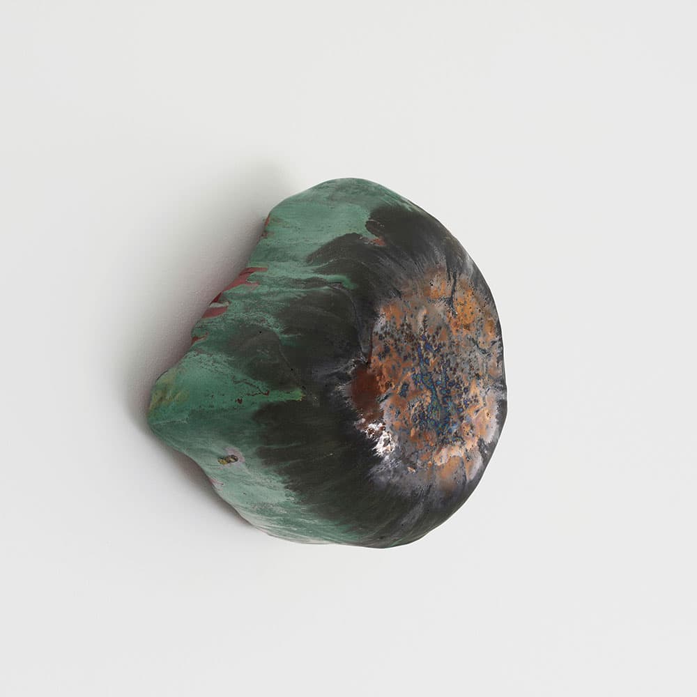 Koo Hyunmo, rock on the wall, 2025.  Ceramic, 23.5 x 20.5 x 17 cm.  Courtesy of the artist & PKM Gallery.